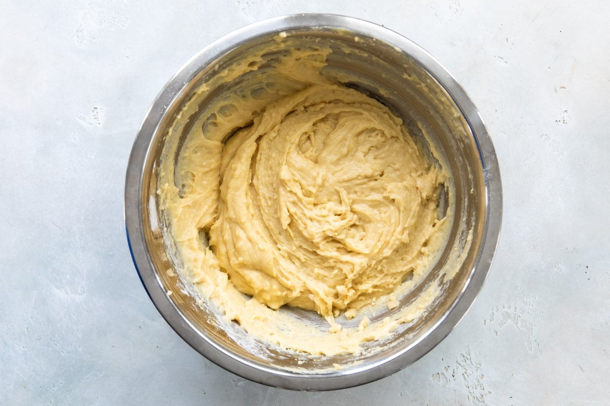 A mixing bowl full of pizzelle batter.
