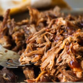 Pulled pork on a baking sheet.