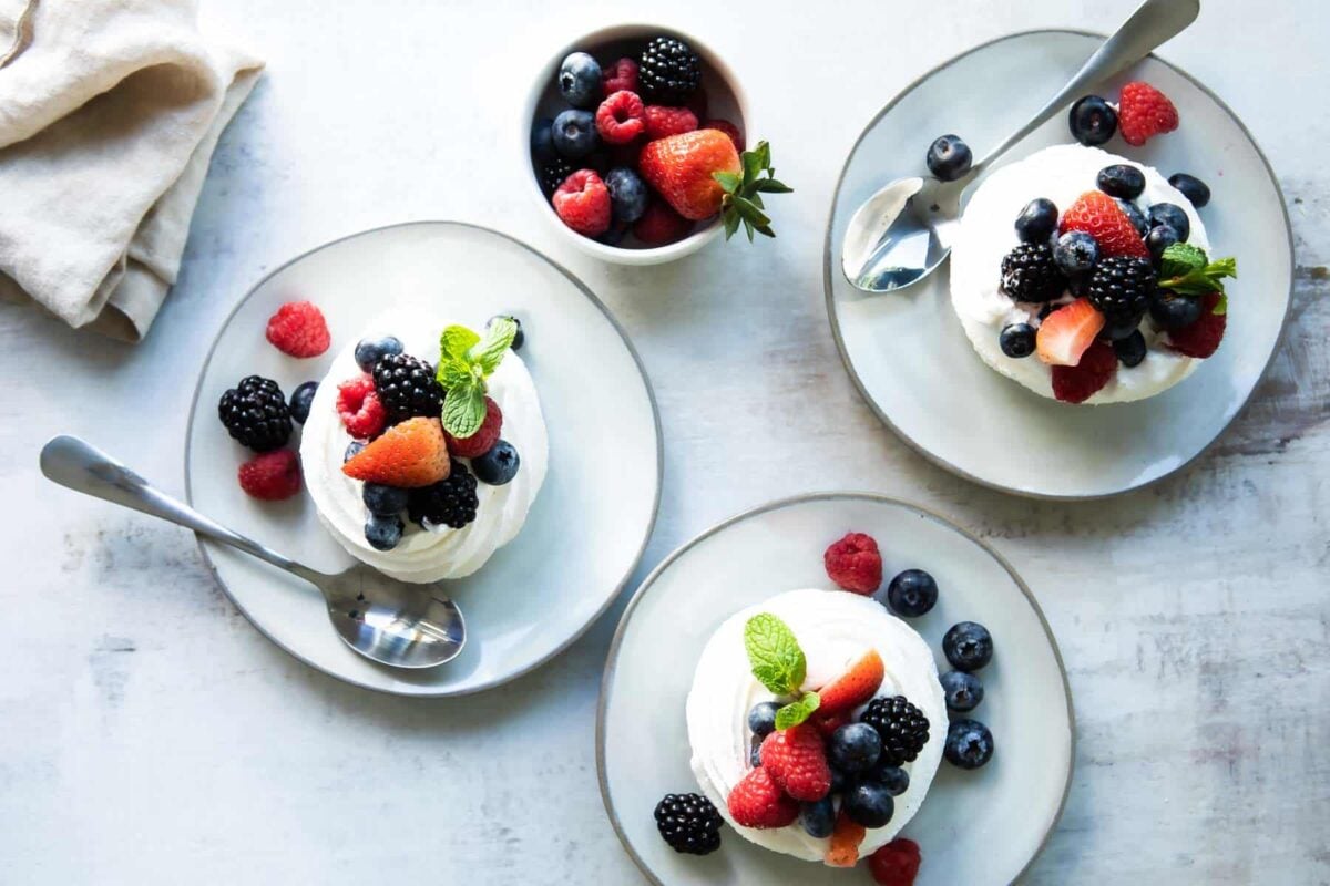 Three Schaum tortes on plates.