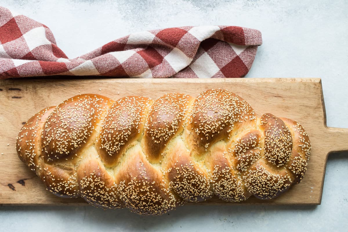 An overhead shot of a baked challah loaf.