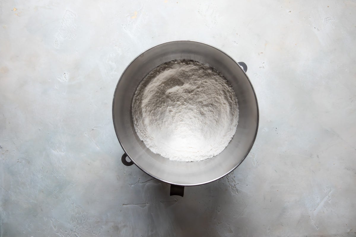 Dry ingredients for vanilla cake in a mixing bowl.