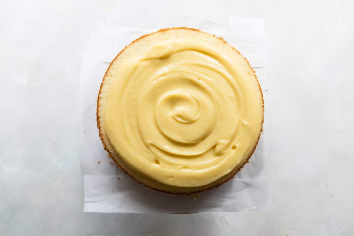 A danish layer cake with a layer of pastry cream on it.
