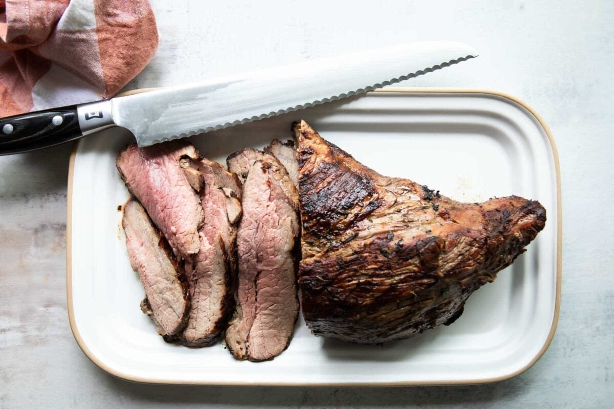 A tri-tip roast with half the meat sliced off.