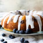Lemon Blueberry cake on a light blue plate.