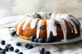 Lemon Blueberry cake on a light blue plate.