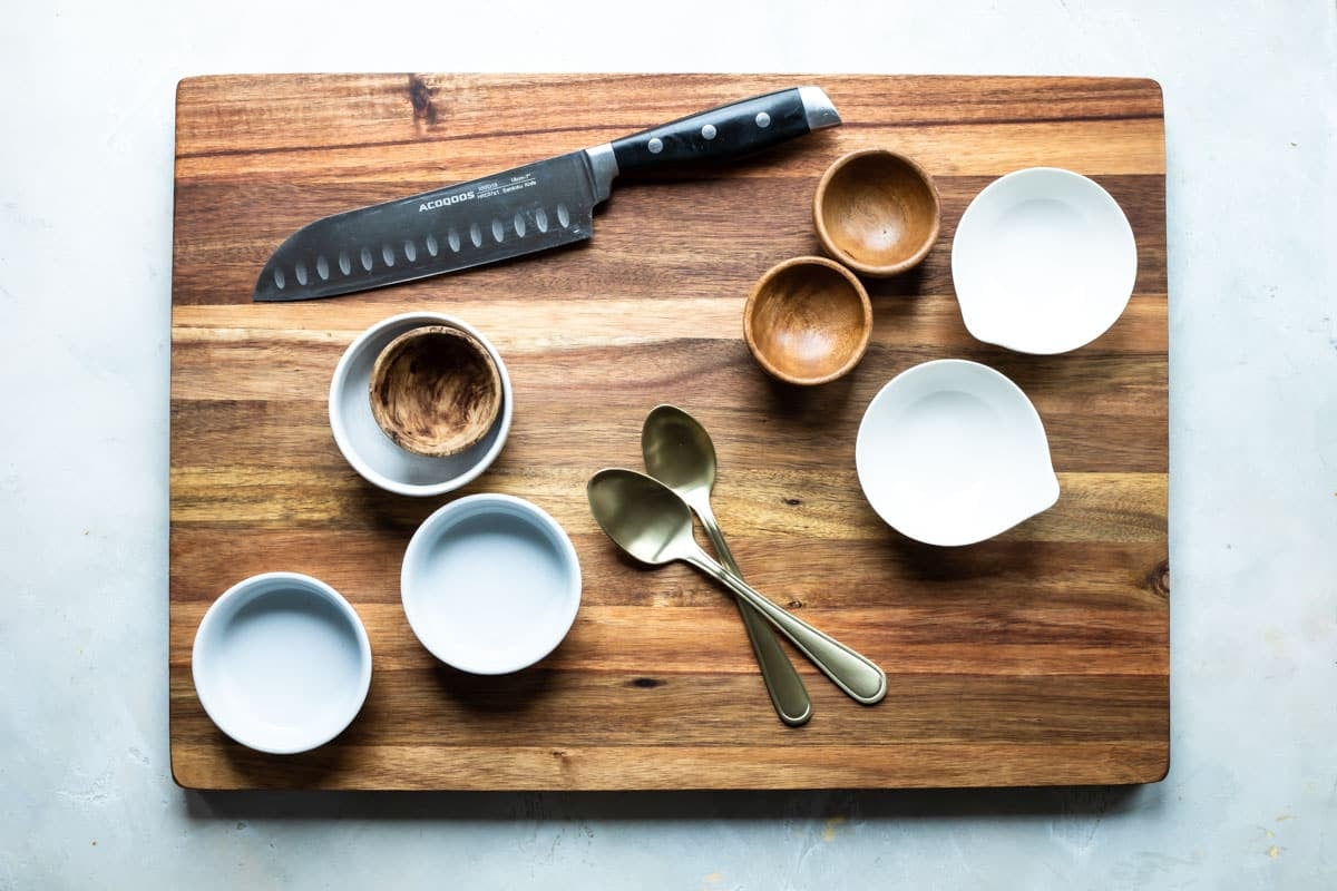 A board and tools for a charcuterie platter.