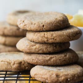 A stack of double ginger cookies on a cooling rack.