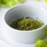 A small white bowl with homemade celery salt.