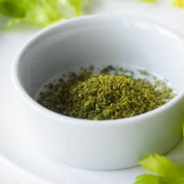 A small white bowl with homemade celery salt.