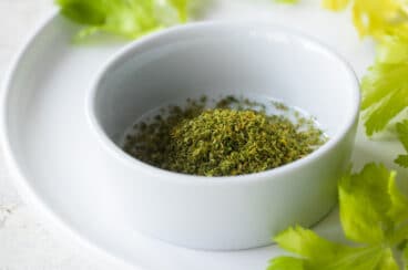 A small white bowl with homemade celery salt.