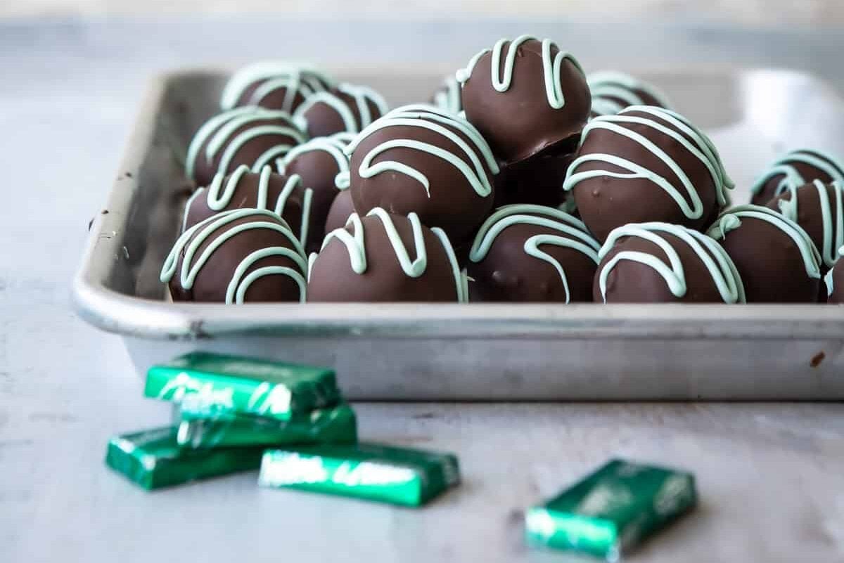 A metal tray full of Oreo mint truffles.