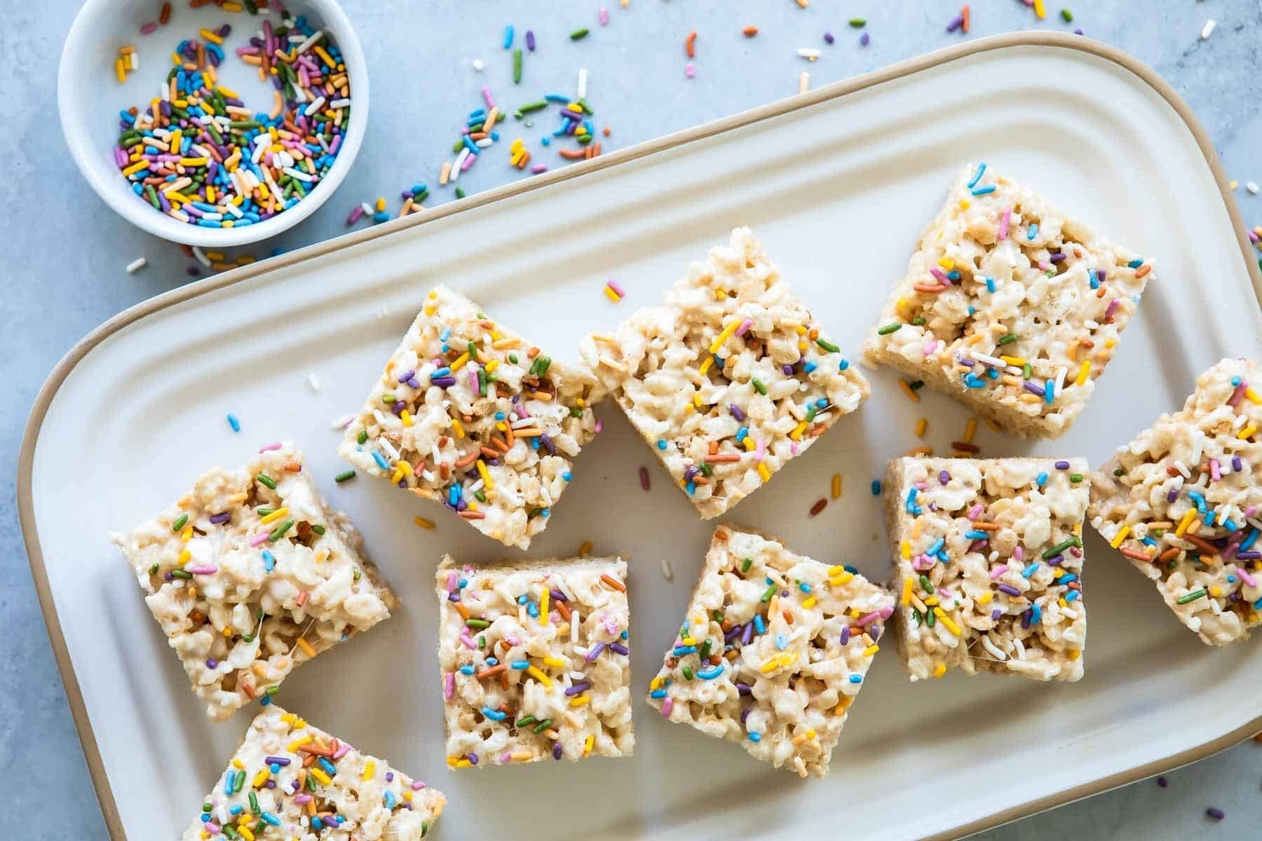 Rice Krispie treats on a rectangular platter.