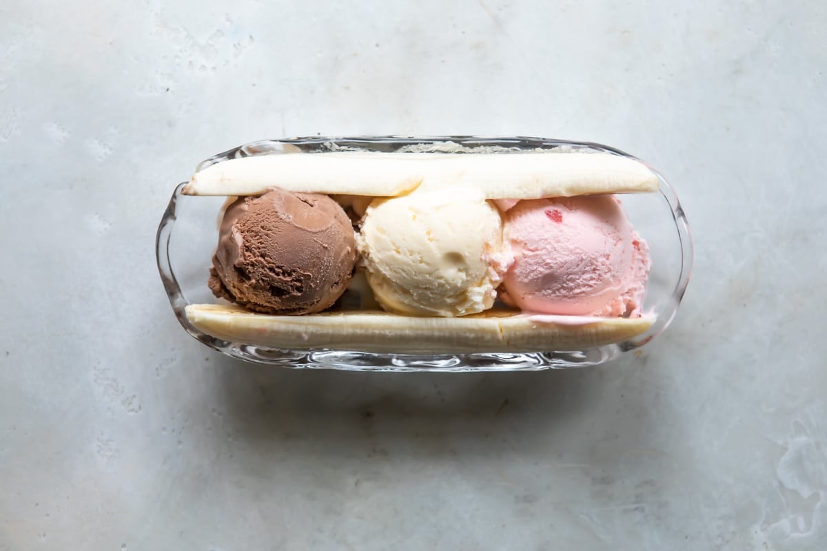 A split banana with ice cream in the middle.