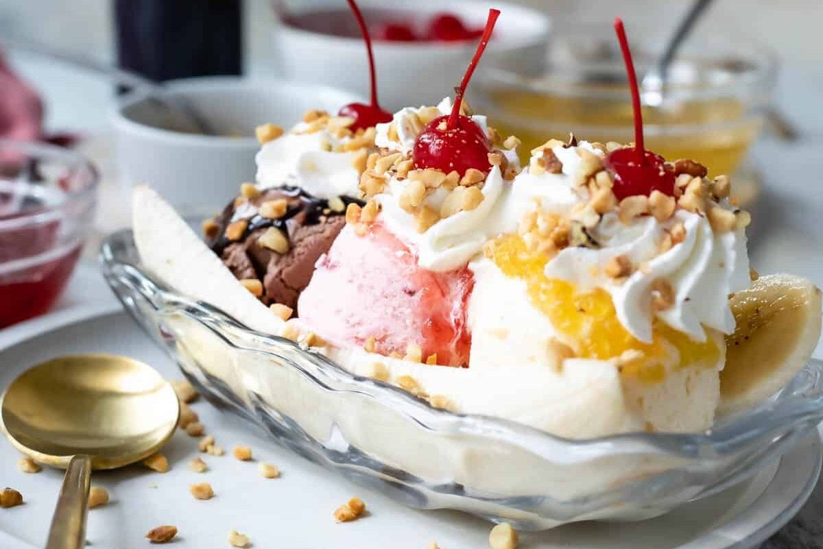 A classic banana split in a glass boat.