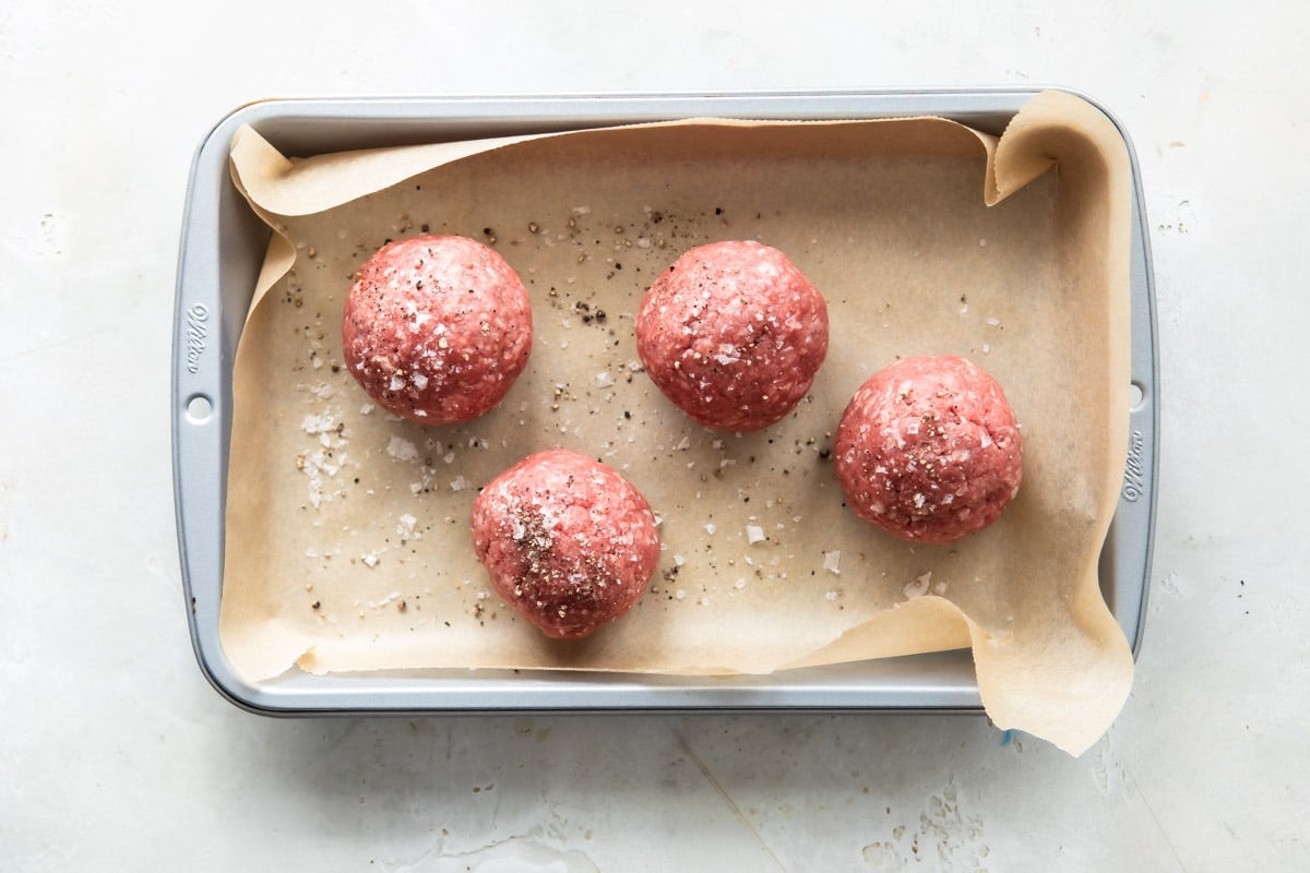 4 balls of ground beef for hamburgers.