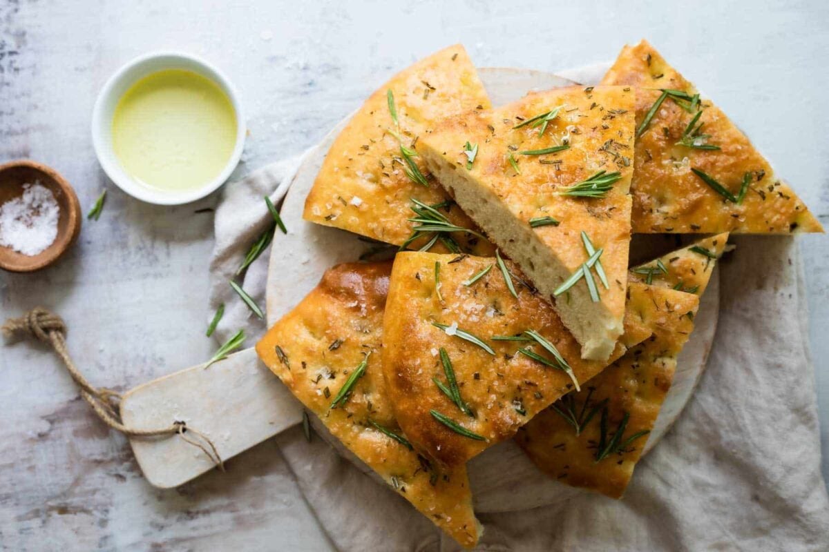 Slices of focaccia bread on a board.
