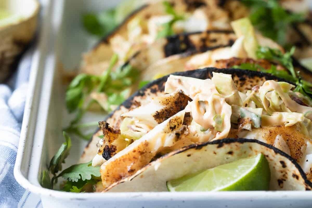 Grilled fish tacos on a platter.