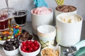Ice cream and toppings on a countertop for an ice cream sundae bar.