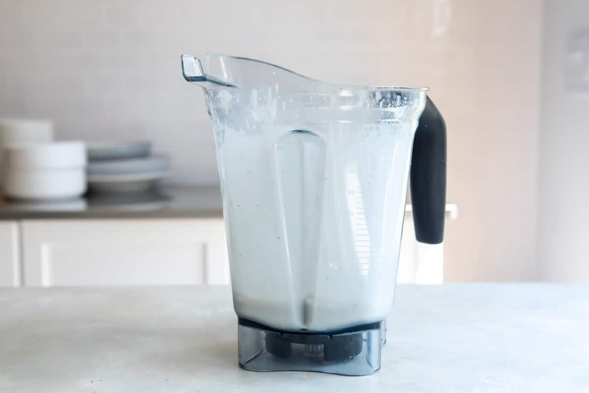 Ingredients for a banana smoothie in a blender.