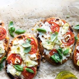 Easy flatbread pizza on a piece of brown parchment paper.