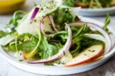 3 plates of fennel salad with apples.