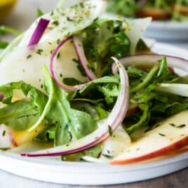 3 plates of fennel salad with apples.