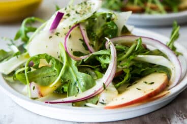 3 plates of fennel salad with apples.