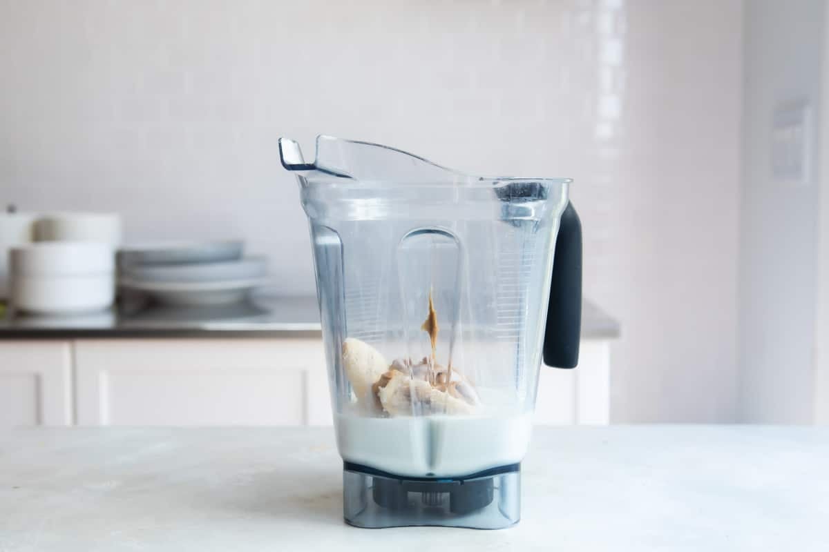 Peanut butter smoothie ingredients in a blender.