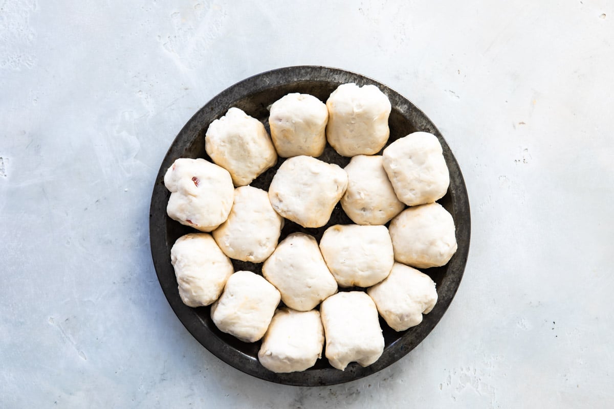 pull-apart pizza bread in a pan before baking.