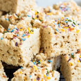 A cooling rack with a stack of rice krispie treats.