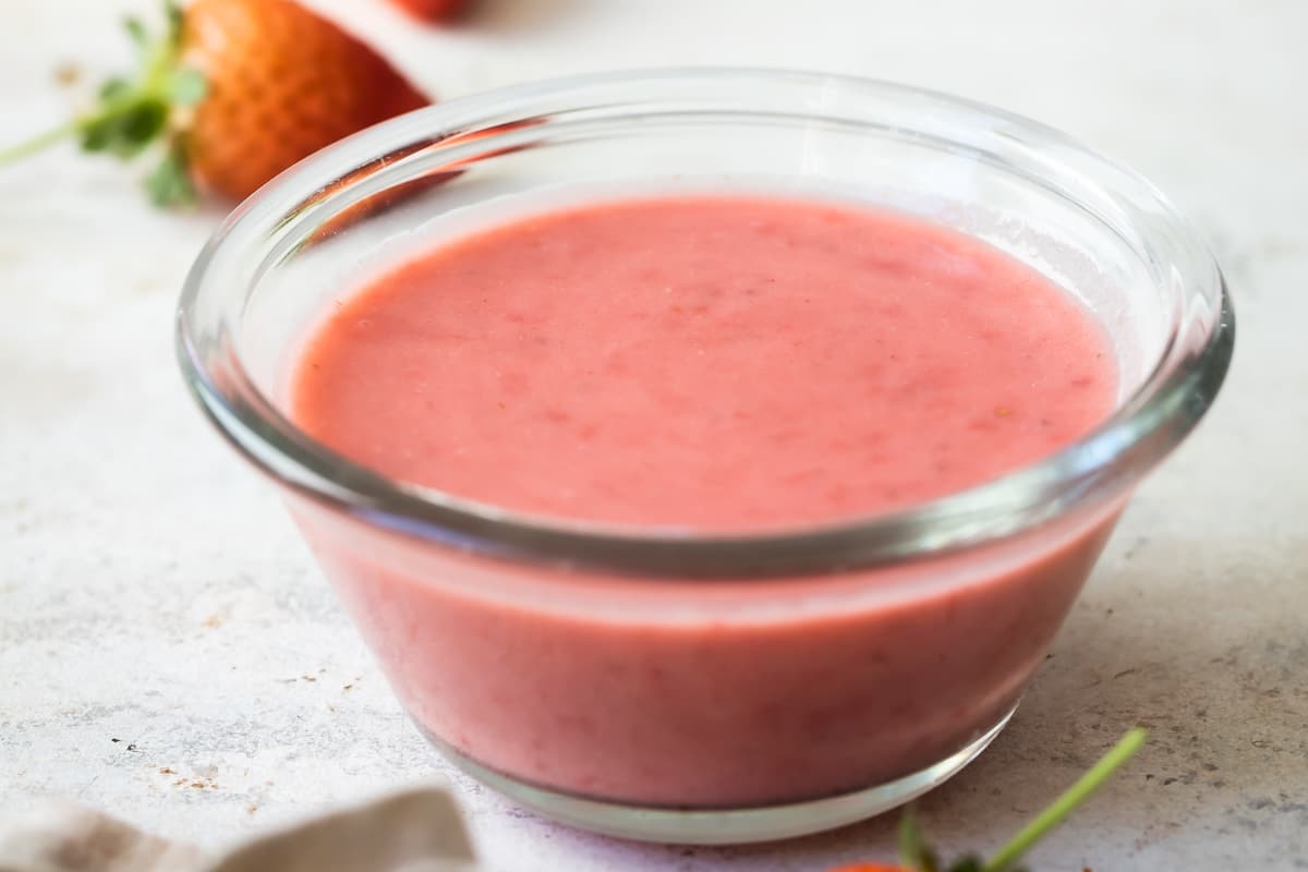 Strawberry Vinaigrette in a clear dish.