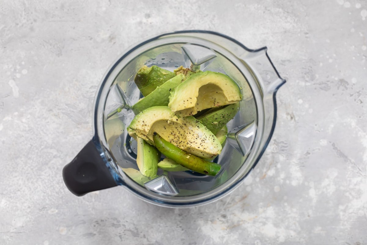 Slices of avocado in a blender.