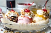 A banana split in a clear dish.
