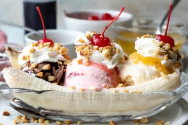 A banana split in a clear dish.