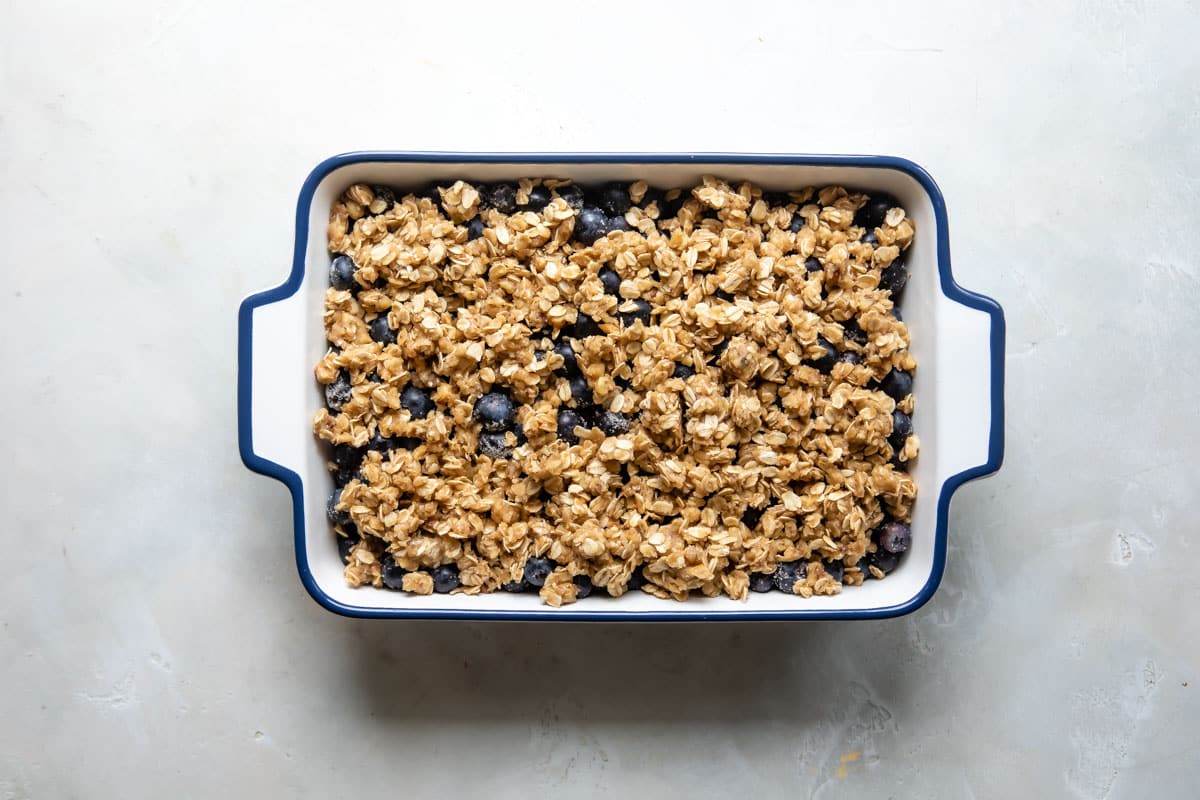 An unbaked blueberry crisp.