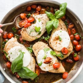 A skillet of Caprese Chicken.