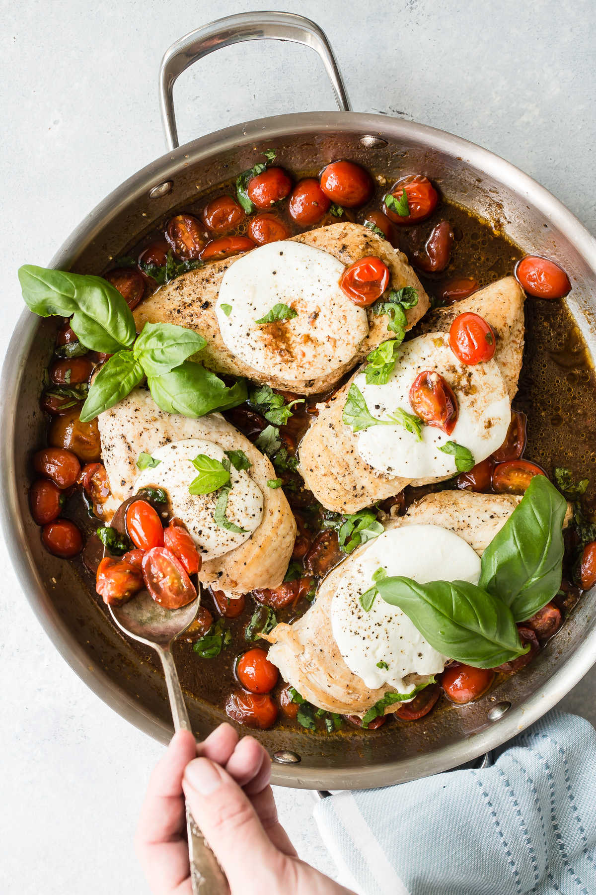 A skillet of Caprese Chicken.