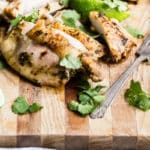 A cutting board full of sliced cilantro-lime chicken