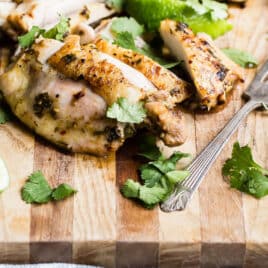 A cutting board full of sliced cilantro-lime chicken