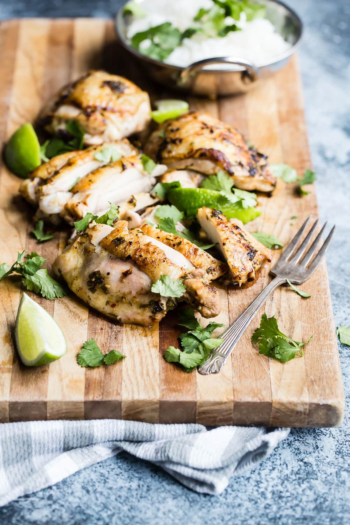 A cutting board full of sliced cilantro-lime chicken