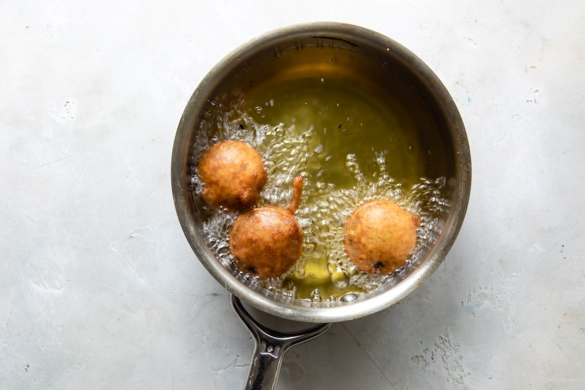Frying battered oreos in oil.