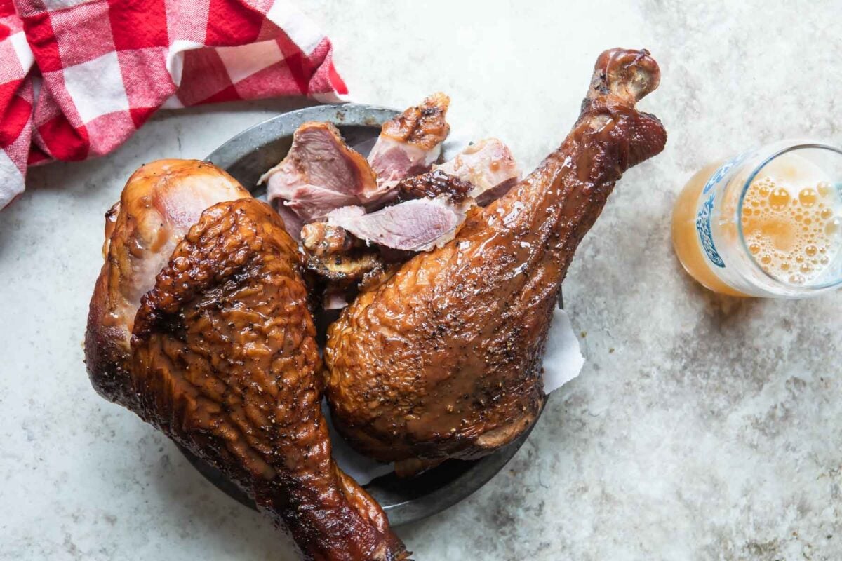 Smoked turkey legs on a plate.