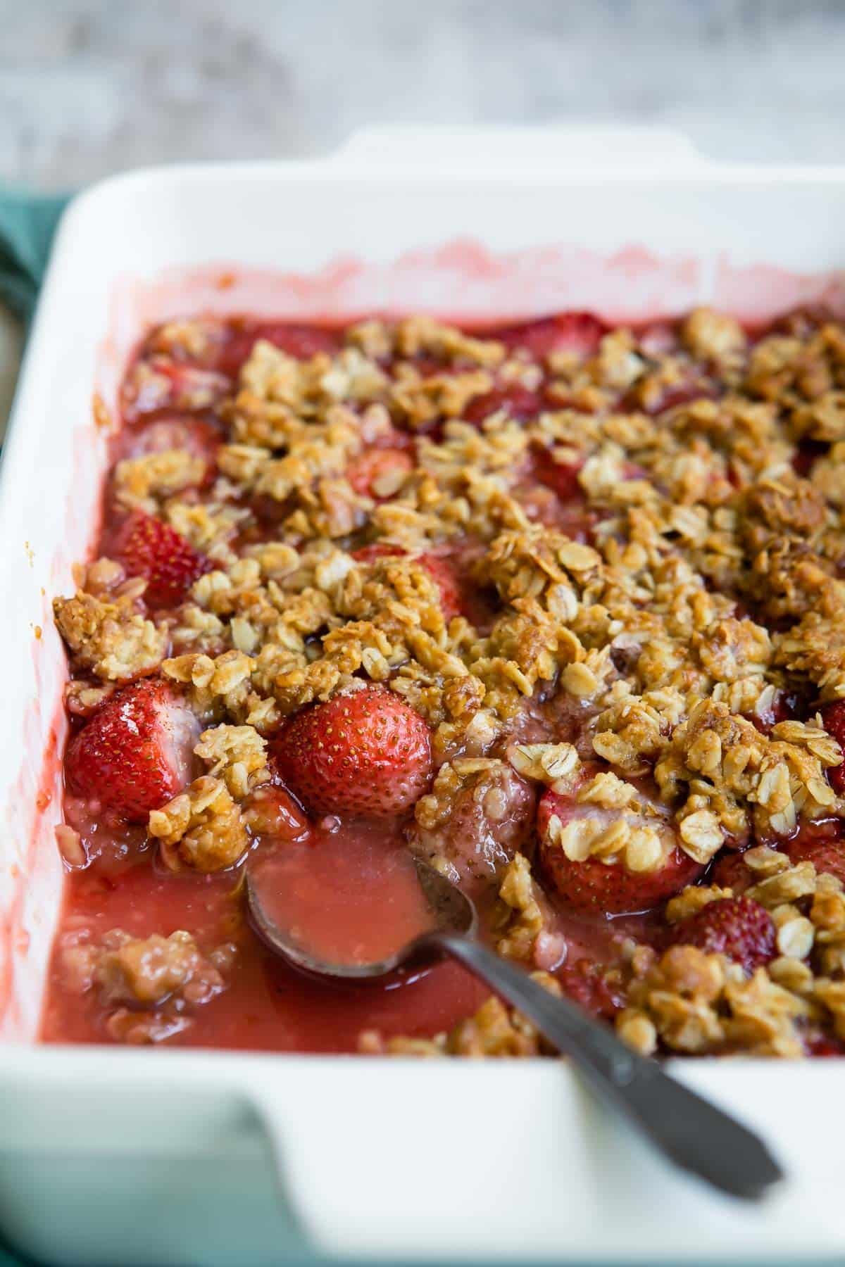 A baking dish full of strawberry crisp.
