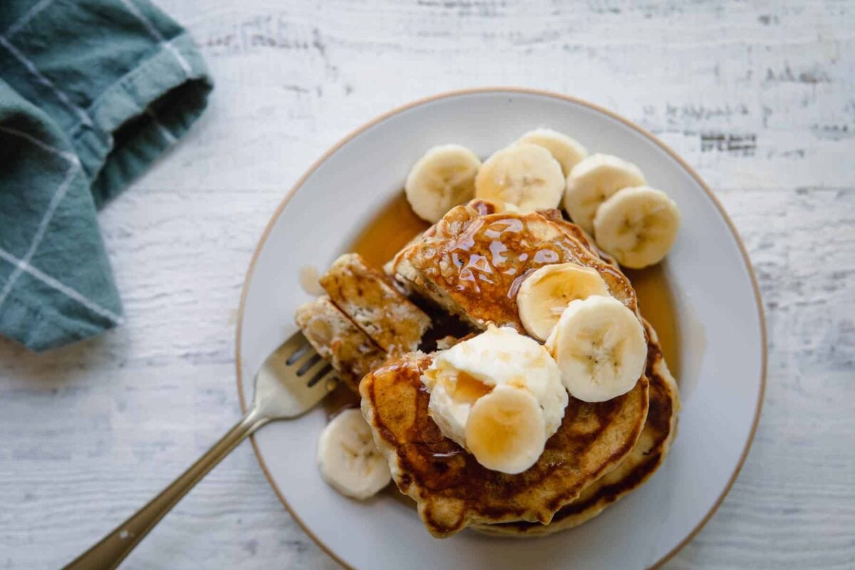 A stack of banana pancakes on a plate.