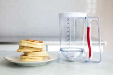 A stack of buttermilk pancakes on a plate.