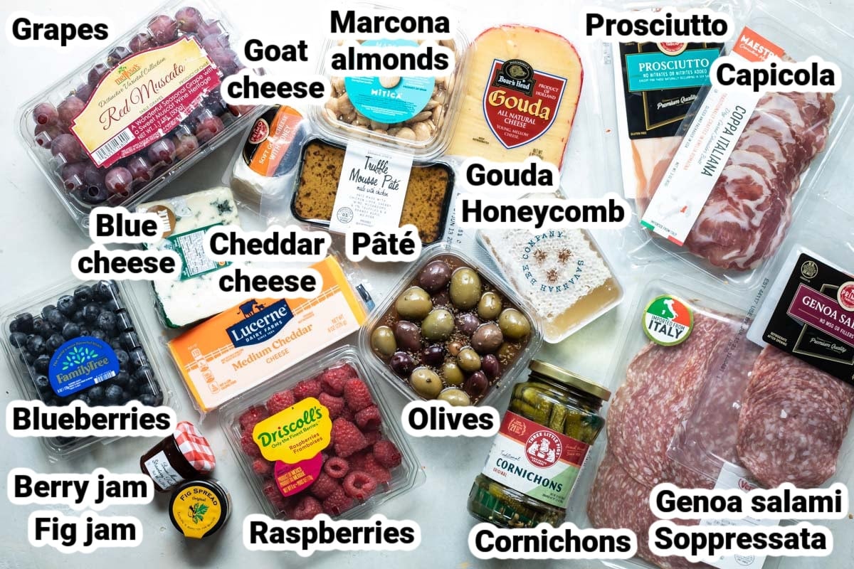Labeled ingredients for a charcuterie board.