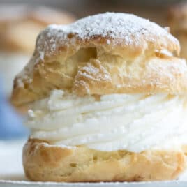 A cream puff on a plate.