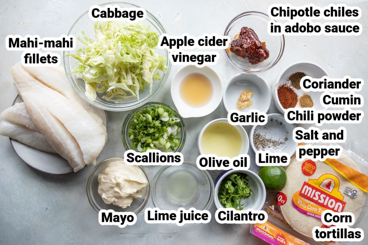 Labeled ingredients for grilled fish tacos with spicy slaw.