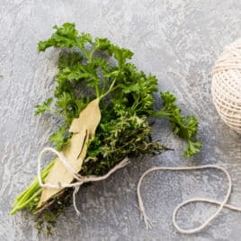 Fresh herbs with twine to make a bouquet garni.