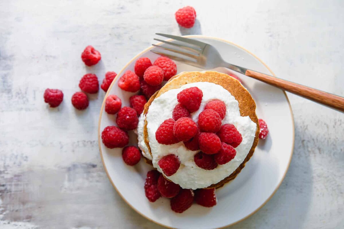 A stack of oatmeal pancakes on a plate.